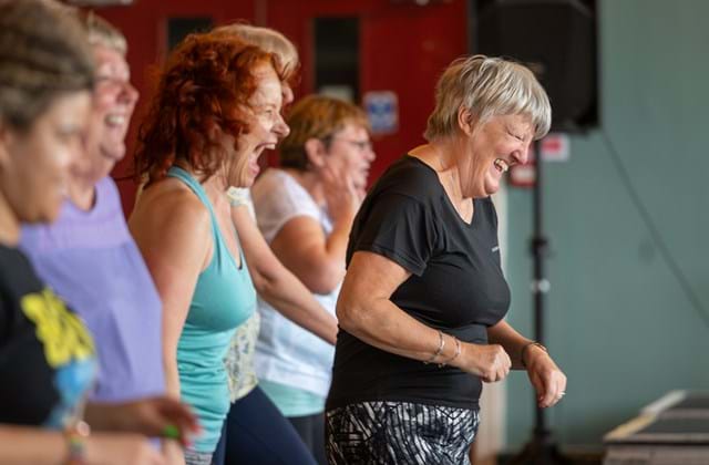 Ladies laughing at a dance class