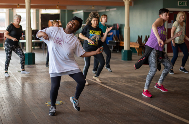 Group of ladies at a dance class, smiling
