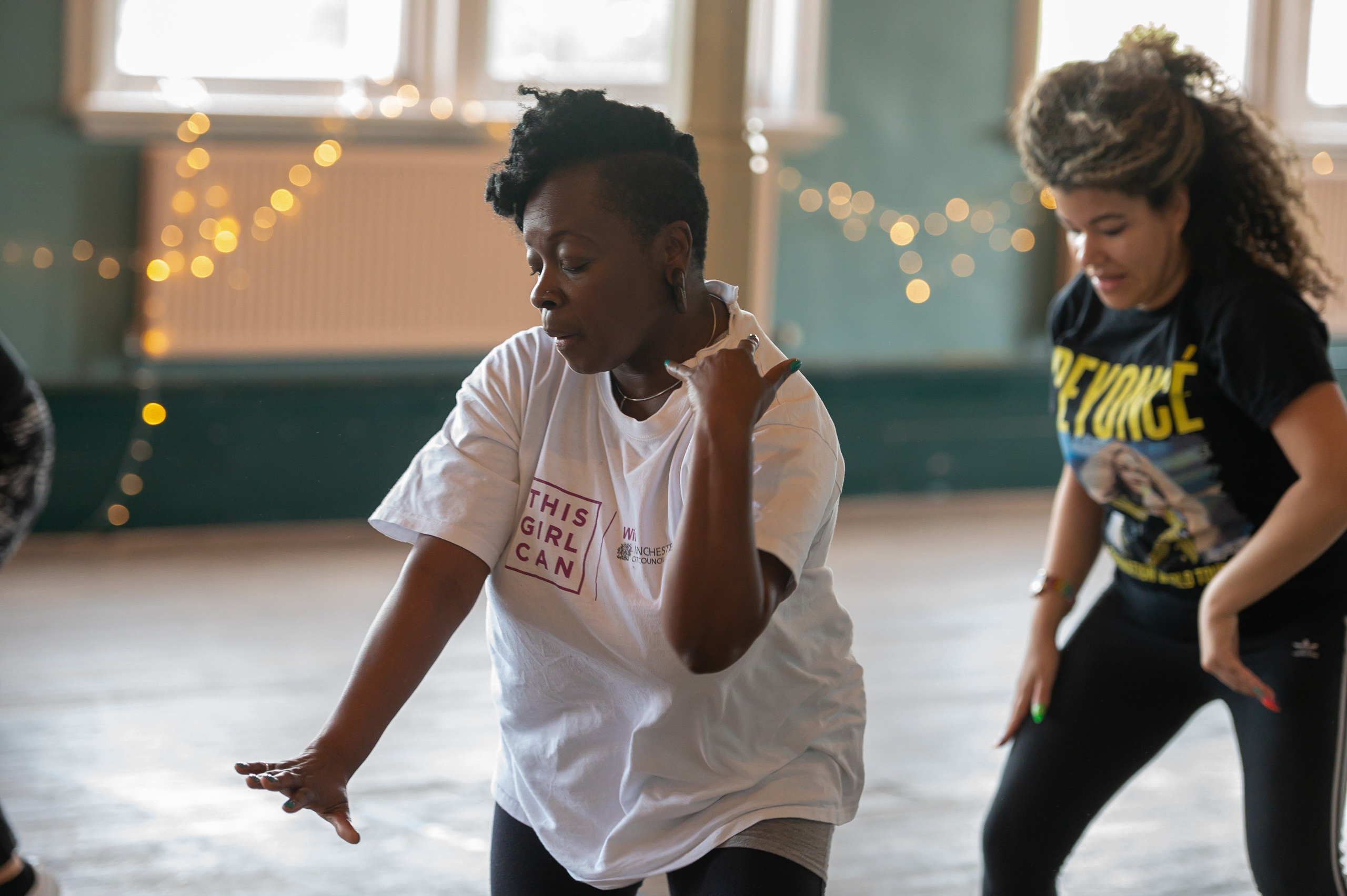 Two women dancing in an exercise class