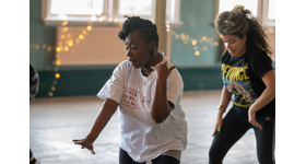 Two women dancing in an exercise class