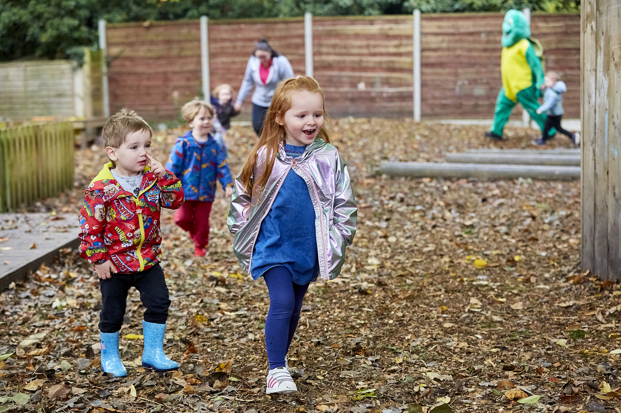 Toddlers walking and running around outside