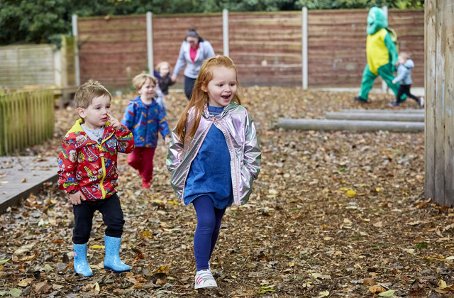 Toddlers walking and running around outside