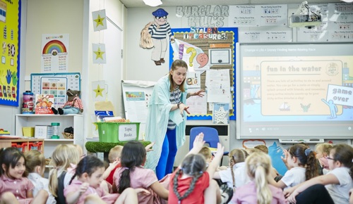 Teacher encouraging class to move more