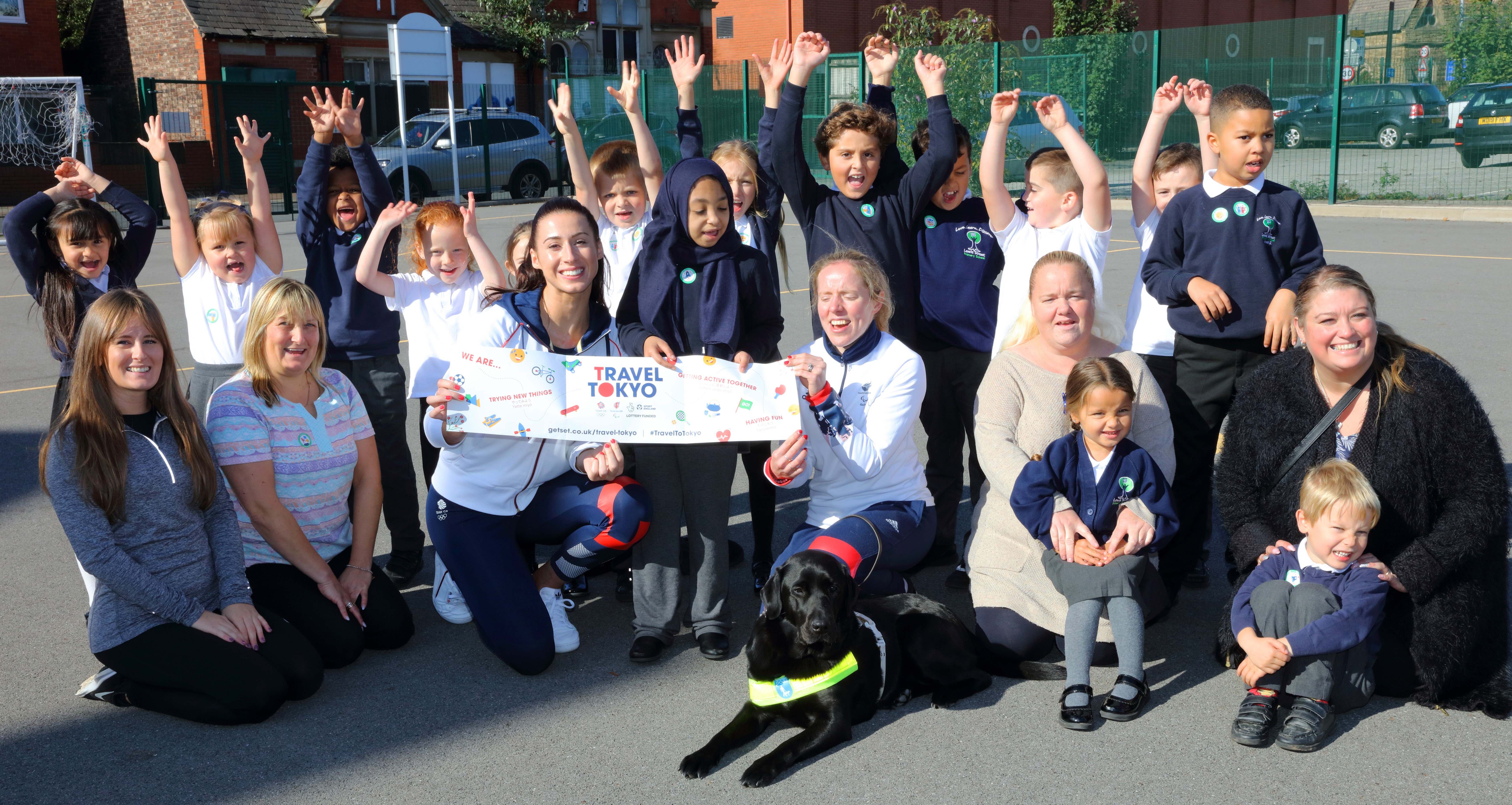 Bianca Walkden and Lora Fachie with students and teachers from Lewis Street Primary School in Salford 