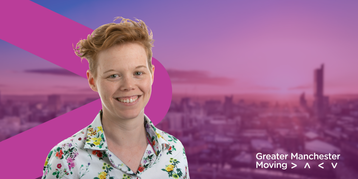 Nicole smiles in front of a branded GM Moving background