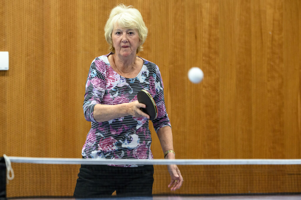 older lady playing table tennis