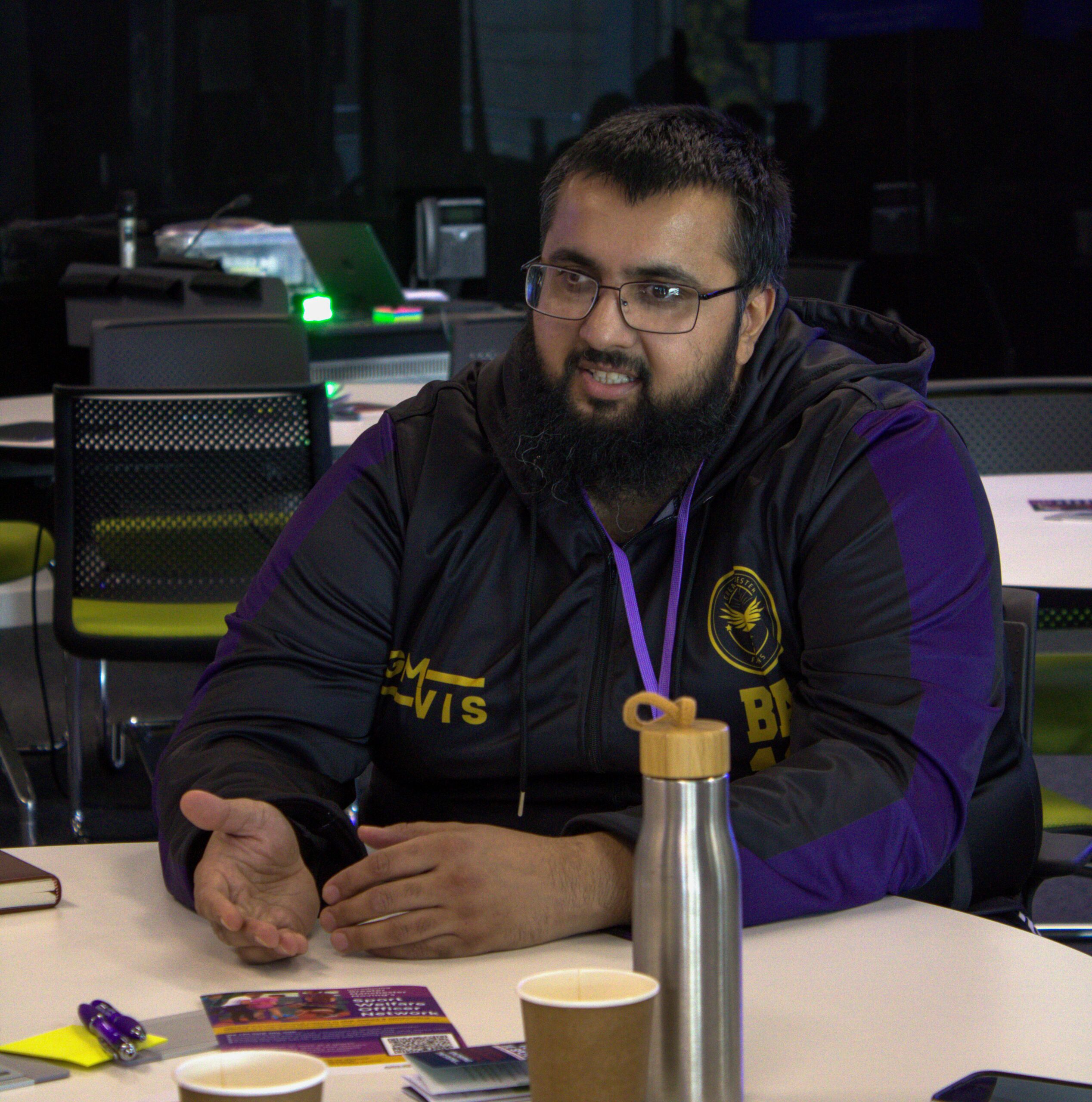 A sports leader sits at a table at the Sports Club Conference 2025