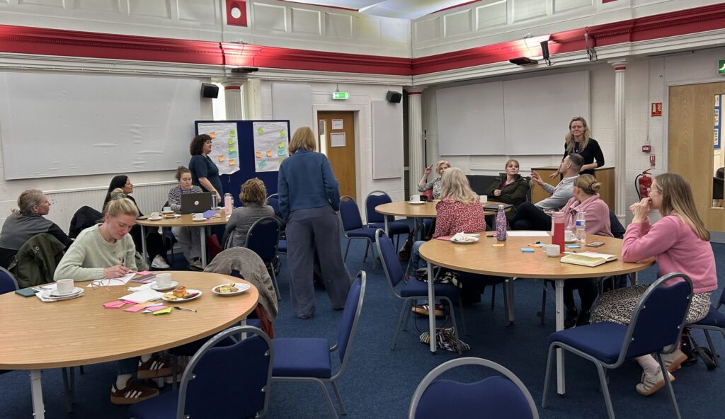 A group of people attend a workshop in Manchester
