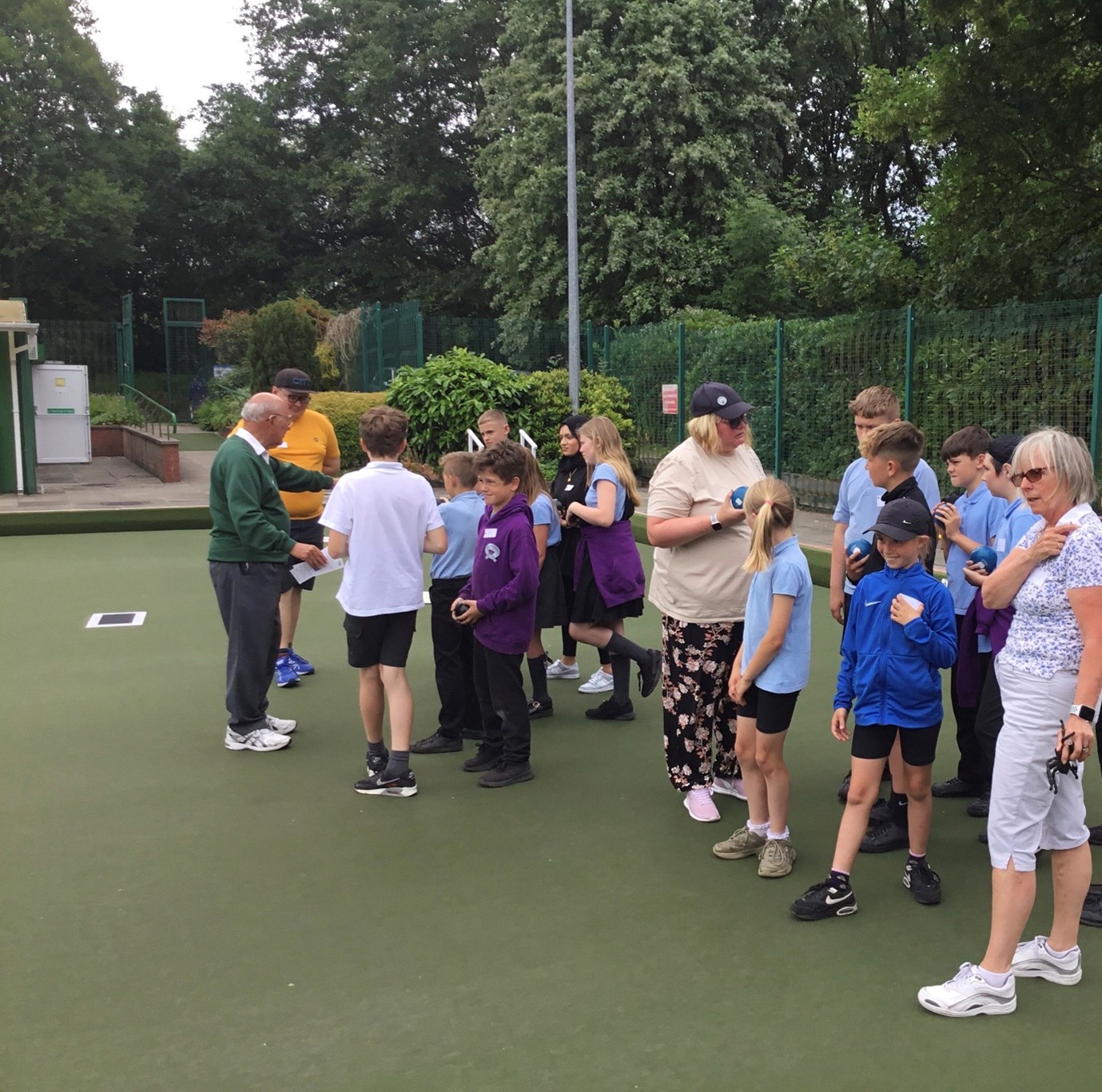 Young People playing bowls at Leverhulme and Bolton Flat Greens Club